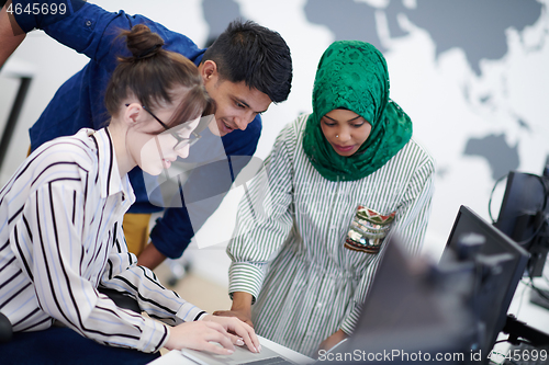 Image of Multiethnic startup business team with Arabian woman