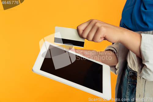 Image of Close up portrait of young muslim woman isolated on yellow studio background