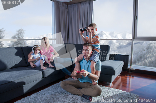 Image of Happy family playing a video game