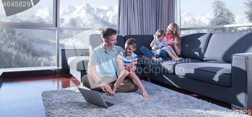 Image of Happy family playing a video game