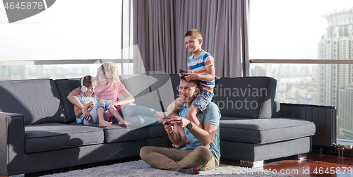 Image of Happy family playing a video game