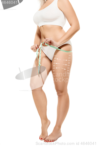 Image of Female body with the drawing arrows. Fat lose, liposuction and cellulite removal concept