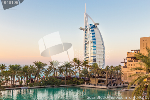 Image of Dubai landmark, seven star luxury hotel Burj Al Arab at dusk, UAE