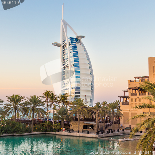 Image of Dubai landmark, seven star luxury hotel Burj Al Arab at dusk, UAE