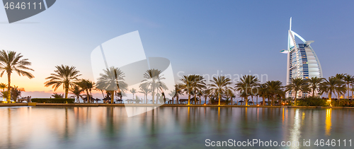 Image of Dubai landmark, seven star luxury hotel Burj Al Arab at dusk, UAE