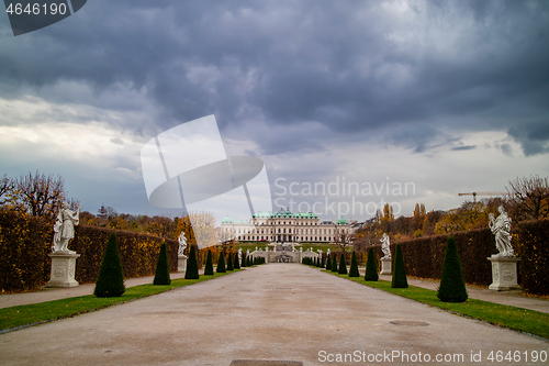 Image of View of Schloss Belvedere Palace with walking alley and ancient statues in Vienna.