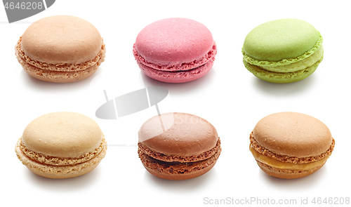 Image of various colorful macaroons on white background