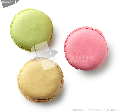 Image of various colorful macaroons on white background