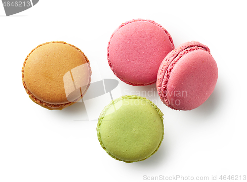 Image of various colorful macaroons on white background