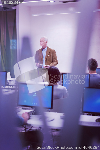 Image of teacher and students in computer lab classroom