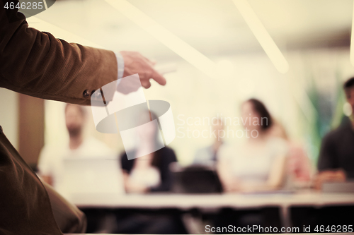 Image of close up of teacher hand while teaching in classroom