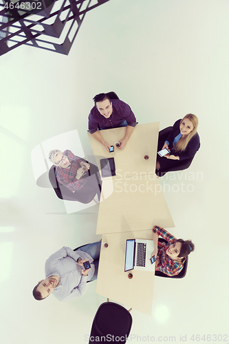 Image of aerial view of business people group on meeting