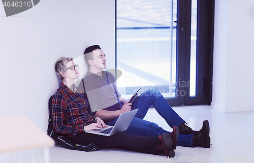 Image of startup business, couple working on laptop computer at office