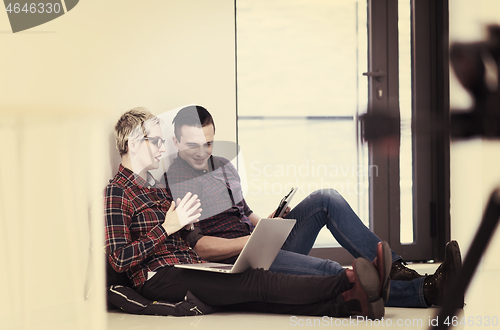 Image of startup business, couple working on laptop computer at office