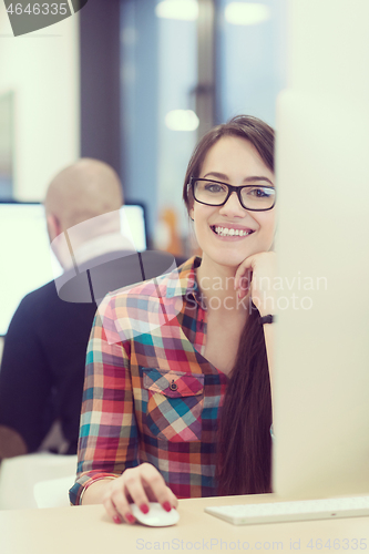 Image of startup business, woman  working on desktop computer