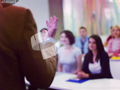 Image of close up of teacher hand while teaching in classroom