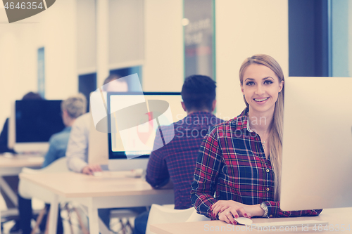 Image of startup business, woman  working on desktop computer