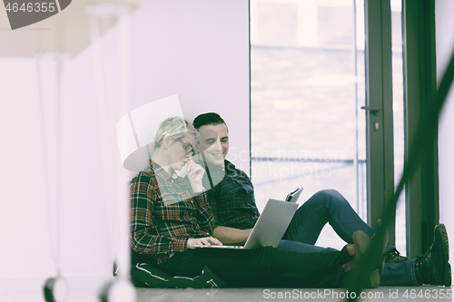 Image of startup business, couple working on laptop computer at office