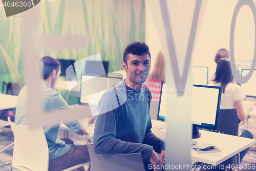 Image of technology students group working  in computer lab school  class