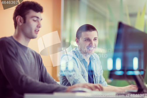 Image of technology students group working  in computer lab school  class