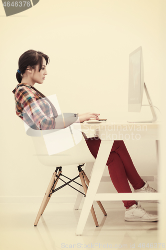 Image of startup business, woman  working on desktop computer