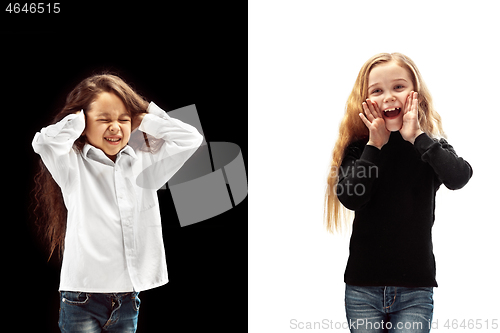 Image of portrait of two happy girls on a white and black background