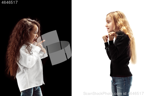 Image of portrait of two emotional girls on a white and black background