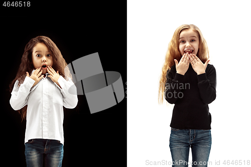 Image of portrait of two happy girls on a white and black background