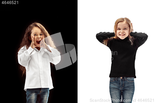 Image of portrait of two happy girls on a white and black background