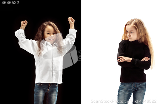 Image of portrait of two emotional girls on a white and black background