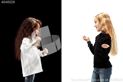 Image of portrait of two emotional girls on a white and black background