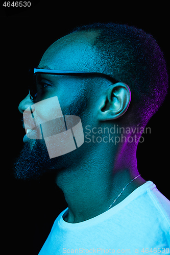 Image of Close up portrait of a young african man indoors