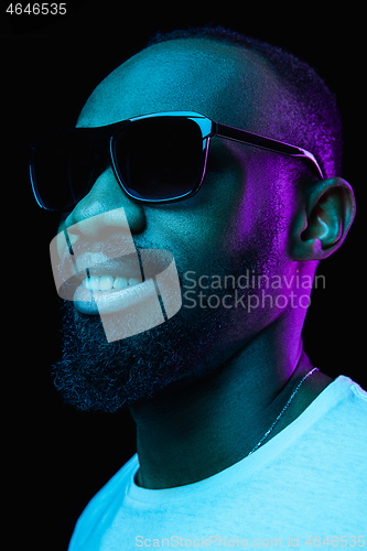 Image of Close up portrait of a young african man indoors