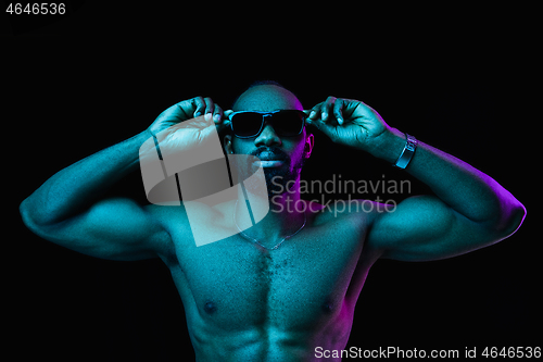 Image of Close up portrait of a young naked african man indoors