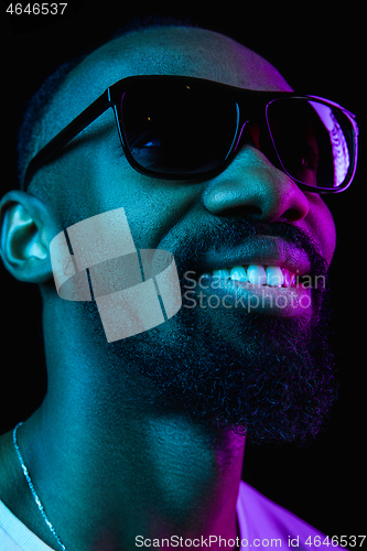 Image of Close up portrait of a young african man indoors