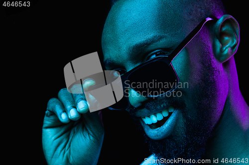 Image of Close up portrait of a young african man indoors