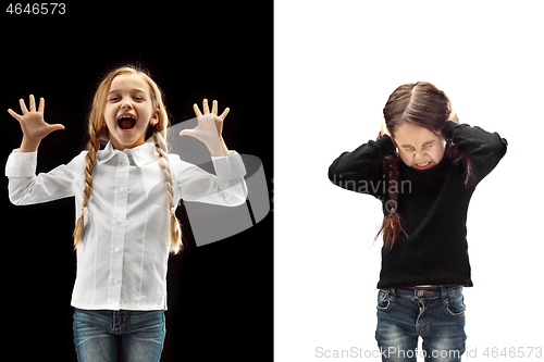 Image of portrait of two happy girls on a white and black background