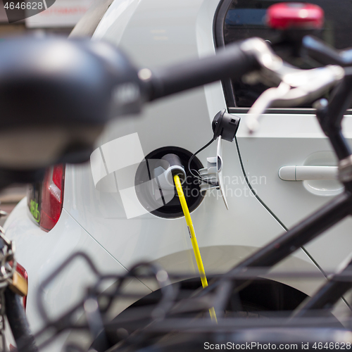 Image of Electric Car in Charging Station.