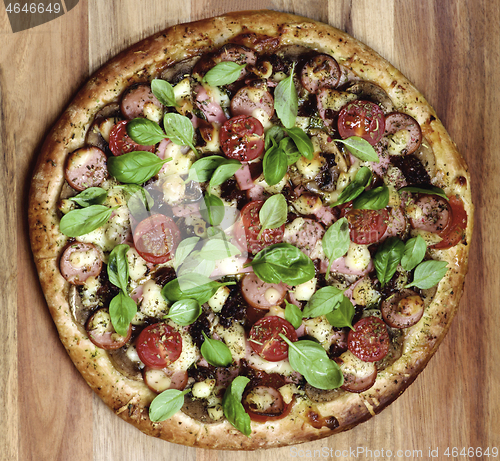 Image of Pizza with Sausages and Tomatoes