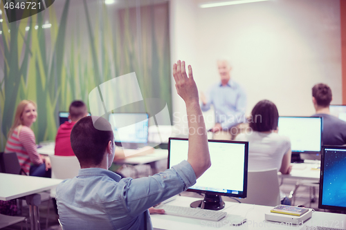 Image of student answering a question in classroom