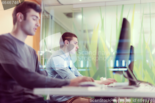 Image of technology students group working  in computer lab school  class