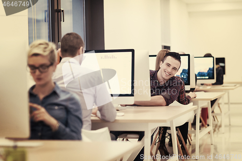 Image of startup business, software developer working on desktop computer