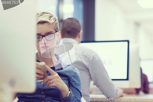 Image of startup business, woman  working on desktop computer