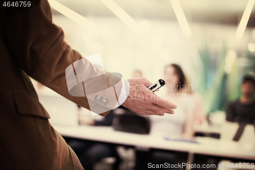 Image of close up of teacher hand while teaching in classroom