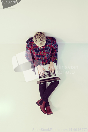 Image of top view of young business woman working on laptop computer