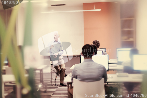 Image of teacher and students in computer lab classroom