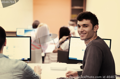 Image of technology students group working  in computer lab school  class