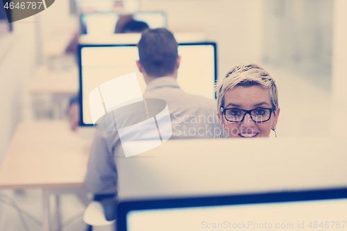 Image of startup business, woman  working on desktop computer