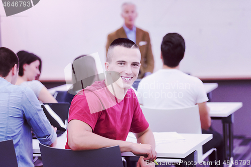 Image of technology students group in computer lab school  classroom