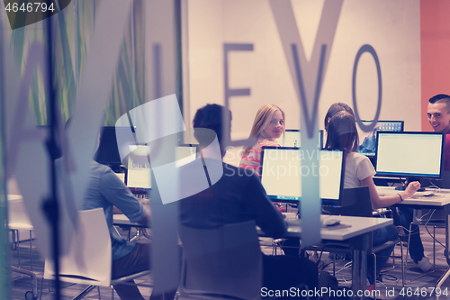 Image of technology students group working  in computer lab school  class